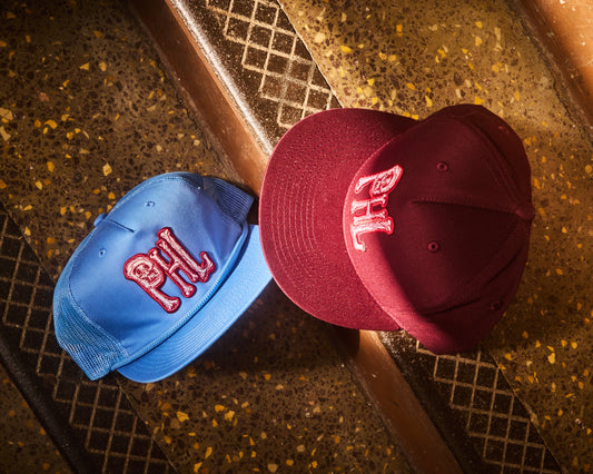 Philadelphia Phillies PHL snap back hats in Phillies maroon and Philadelphia Phillies light blue design. Maroon 5 panel snapback, light blue 5 panel surf style hat with corded brim